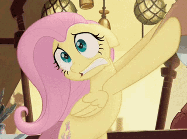 a close up of a cartoon pony with a surprised look on her face