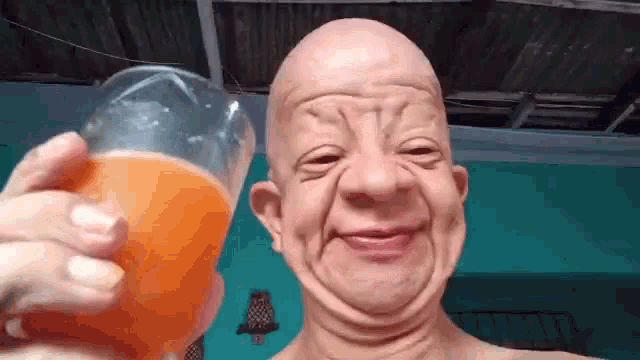 Bald Man Drinking Orange Juice GIF - Bald Man Drinking Orange Juice GIFs
