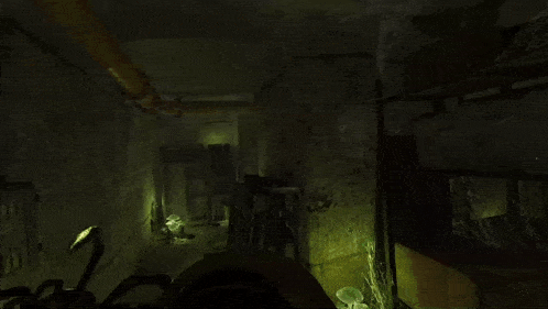 a statue of a spider in a dark room with a green light behind it