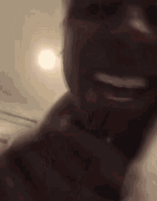 a close up of a person 's face with their tongue sticking out