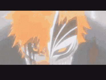 a close up of a person wearing a mask with orange hair .