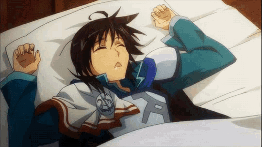 a cartoon character is laying on a bed with his eyes closed and the letter a on his chest