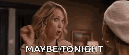 a woman is talking to another woman and saying `` maybe tonight '' while making a funny face .