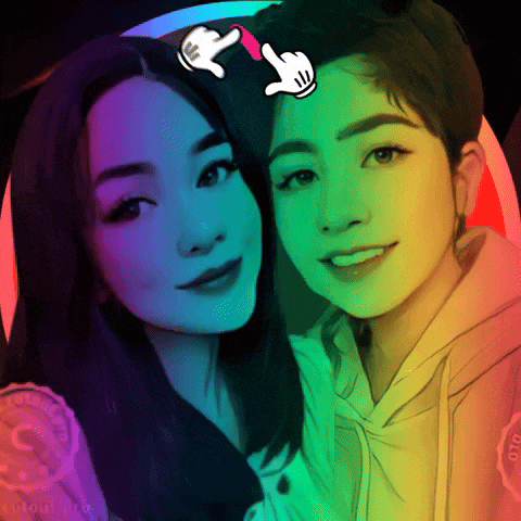 a rainbow colored drawing of two women with a hand pointing at one
