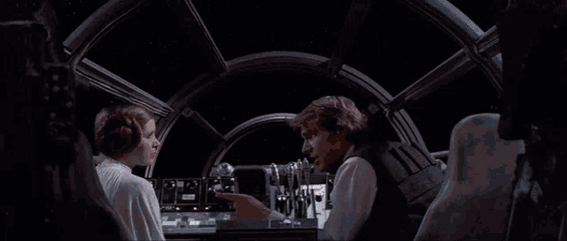 a man and a woman are sitting in a spaceship with the words i expect to be well paid above them