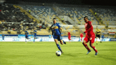 a soccer player in a blue jersey with the number 23 on the back
