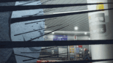 a blurry picture of a building with a sign on the wall that says ' a '