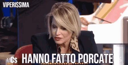 a woman sitting in front of a piano with the words viperissima written on the bottom