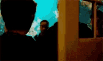 a blurry picture of a man in a dark room