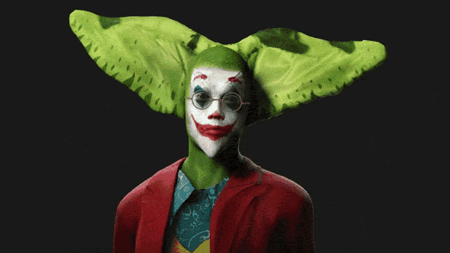 a joker with glasses and a green leaf on his head says " oh hell yup "