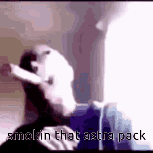 a man is smoking a cigarette with the words smokin that astra pack written below him