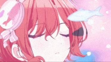 a girl with red hair is sleeping with her eyes closed and a fish is floating above her head .