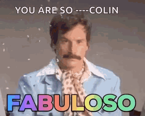 a man with a mustache is wearing a blue jacket and a rainbow scarf .