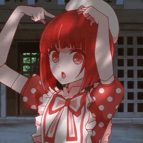 a girl with red hair and white polka dots on her shirt