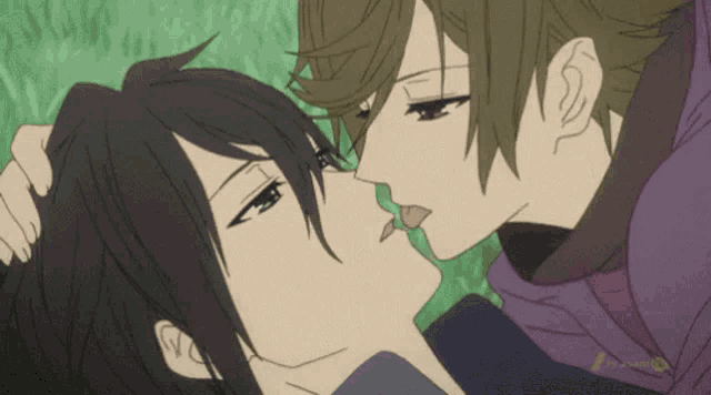 a couple of anime characters kissing each other with the letters tv-anime on the bottom right