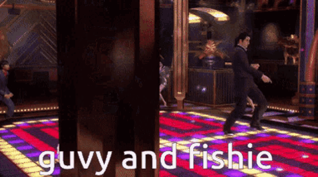 a man is dancing on a dance floor and the words guvy and fishie are above him