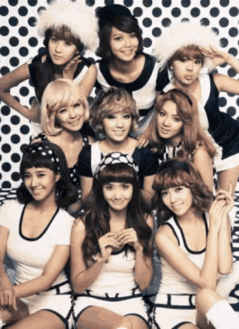 a group of young women are posing for a picture together .