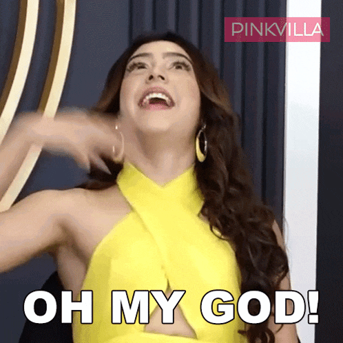 a woman in a yellow dress is laughing and saying " oh my god "