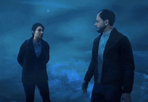 a man and a woman are standing next to each other with the text hold on wife texting