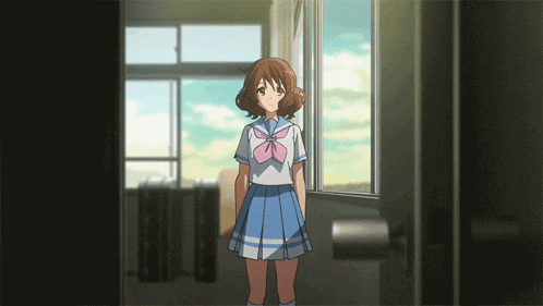 a girl in a school uniform is standing in a doorway looking out a window