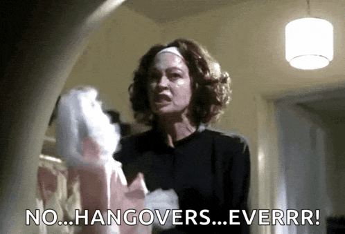 a woman is holding a bag of cotton candy and saying no hangovers ever .
