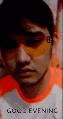 a close up of a man wearing sunglasses with the words `` good evening '' written below him .