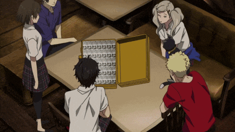 a group of people are sitting around a table with a tray on it that says ' n ' on it