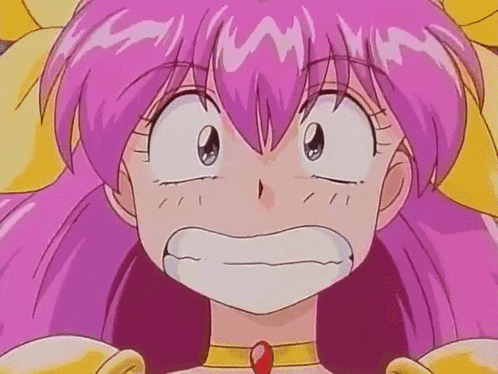a close up of a pink haired anime girl making a face