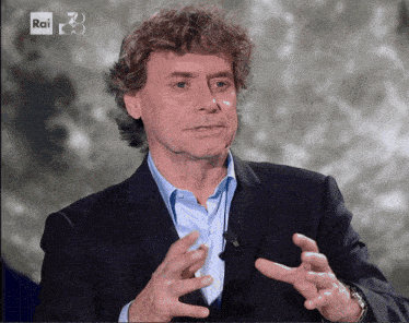 a man in a suit is talking on a rai 3 channel