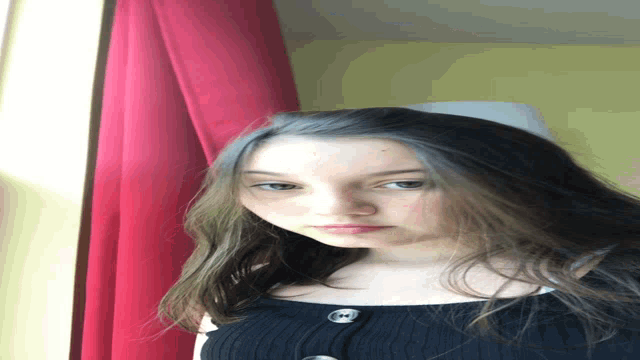 a girl laying on a bed with her head down