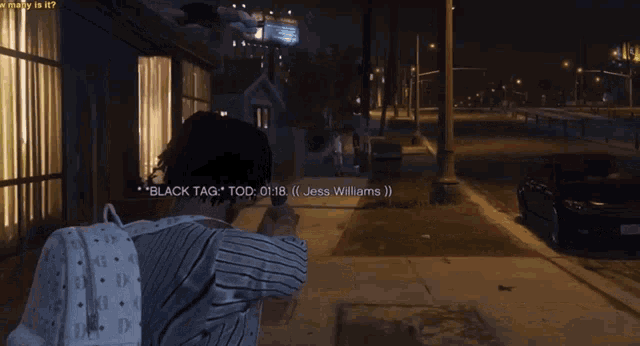 a man in a hospital gown is holding a gun and says " black tag " tod
