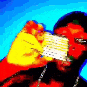 a man is holding a piece of paper in his mouth .