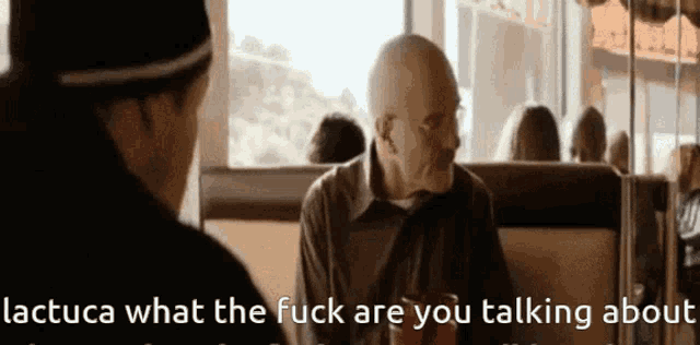 a man sitting in a diner with the words lactuca what the fuck are you talking about on the bottom