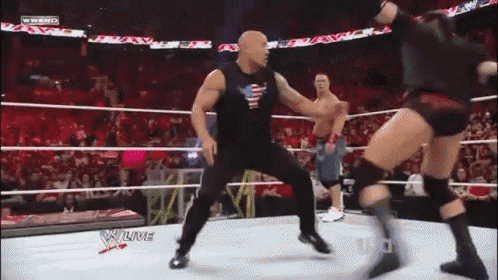 a wrestler in a black tank top with an american flag on it