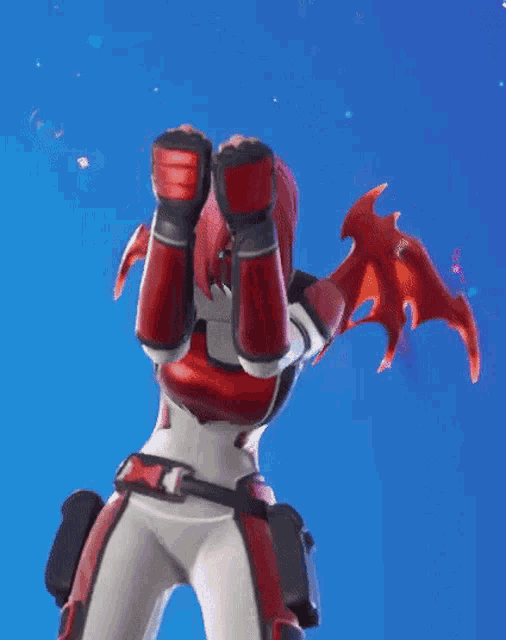 a woman in a red and white outfit with dragon wings is covering her face with her hands