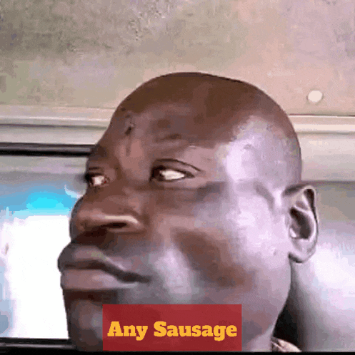 a man with a red sticker that says any sausage on it