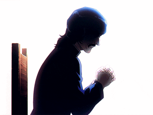 a man with his hands folded praying in front of a white wall