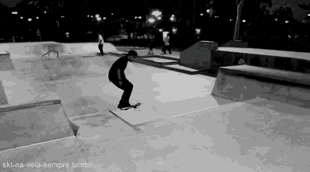 a man is doing a trick on a skateboard in a black and white photo