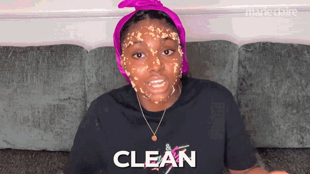 a woman wearing a black t-shirt that says clean