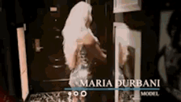 a maria durbani model is standing in front of a mirror
