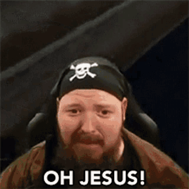 a man with a beard is wearing a pirate hat and saying `` oh jesus ! ''