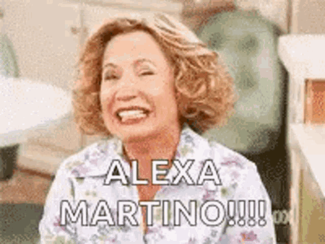 a woman is laughing with the words `` alexa martino !!! '' written on her face .