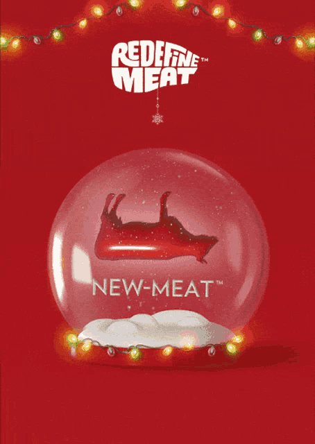 a snow globe with a picture of a pig and the words " redefine meat " on the top