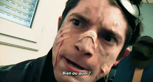 a man with a bandage on his face is asking " bien ou quoi "