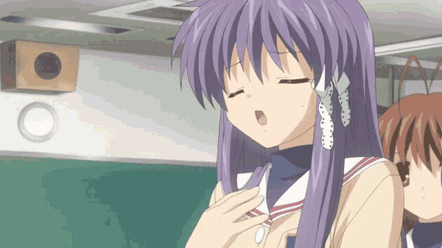 a girl with purple hair is wearing a pair of ear cuffs