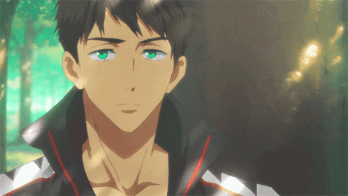 a close up of a man with green eyes