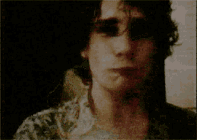 a close up of a man 's face with a surprised look on his face
