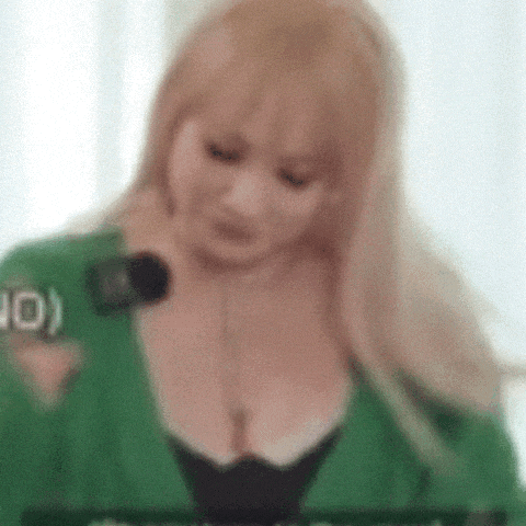 a woman in a green shirt with the number 10 on her sleeve