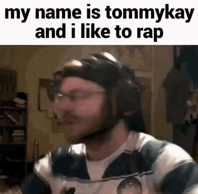 a man wearing headphones and glasses says his name is tommykay and he likes to rap