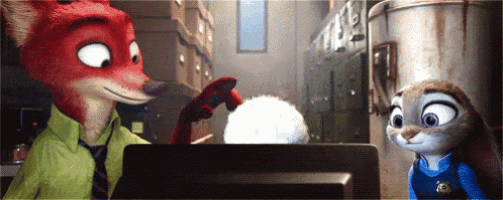 a fox and a rabbit are standing next to each other in front of a computer screen